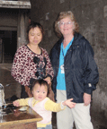 Barb Belknap with mom and child in China